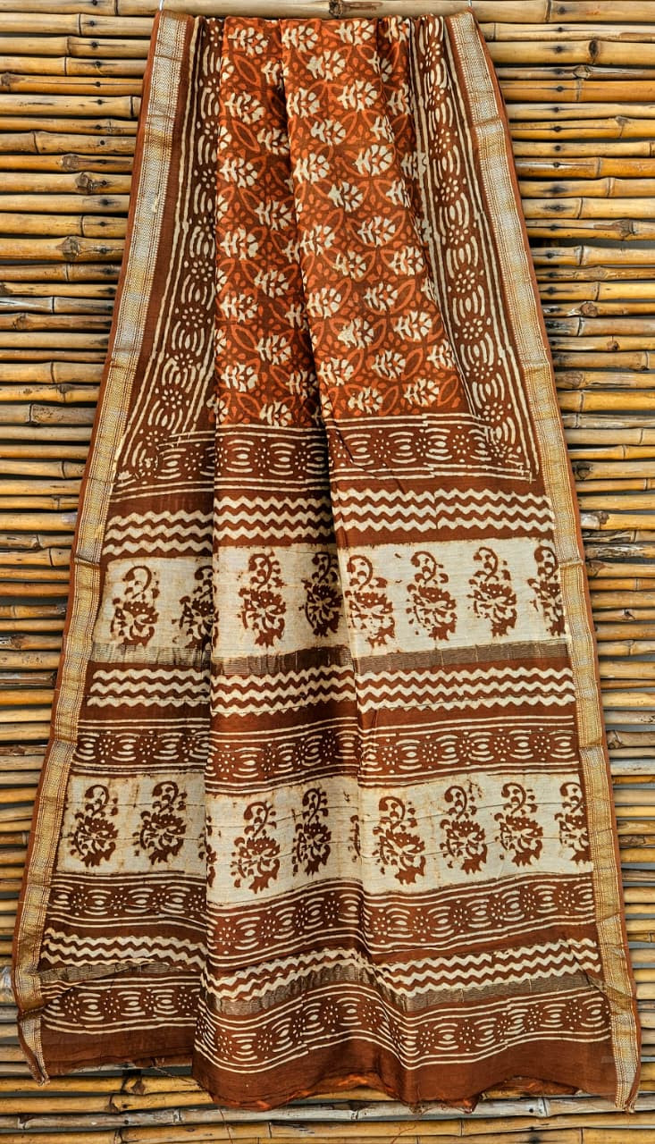 Terracotta brown and off-white hand block printed Maheshwari silk cotton blend saree