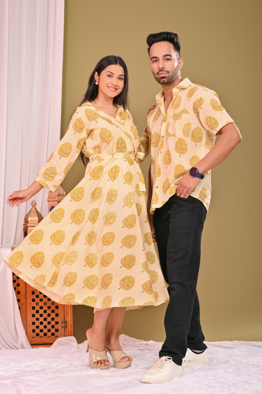 A matching couple's outfit in a yellow and off-white leaf-patterned print, made from a cotton material