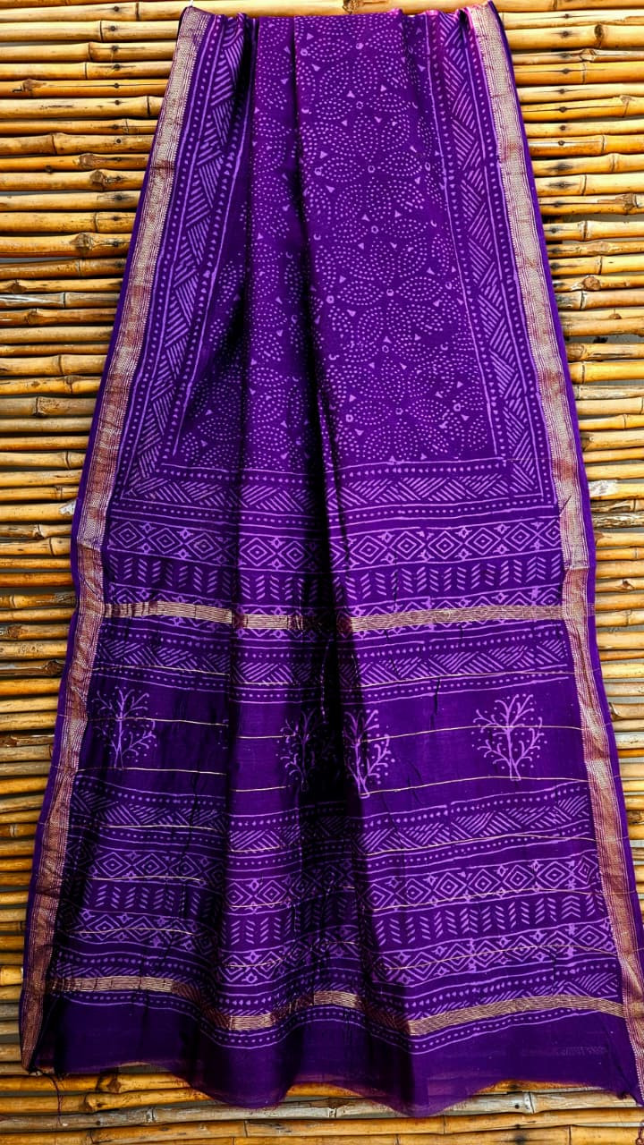 purple Maheshwari silk/cotton hand-block printed saree with a golden zari border.