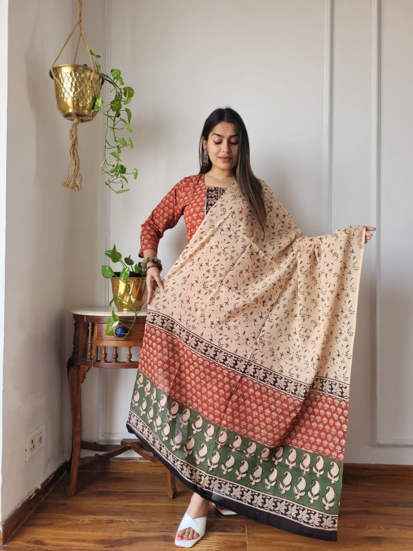 beige and rust floral block-printed cotton kurta set with green and black borders.
