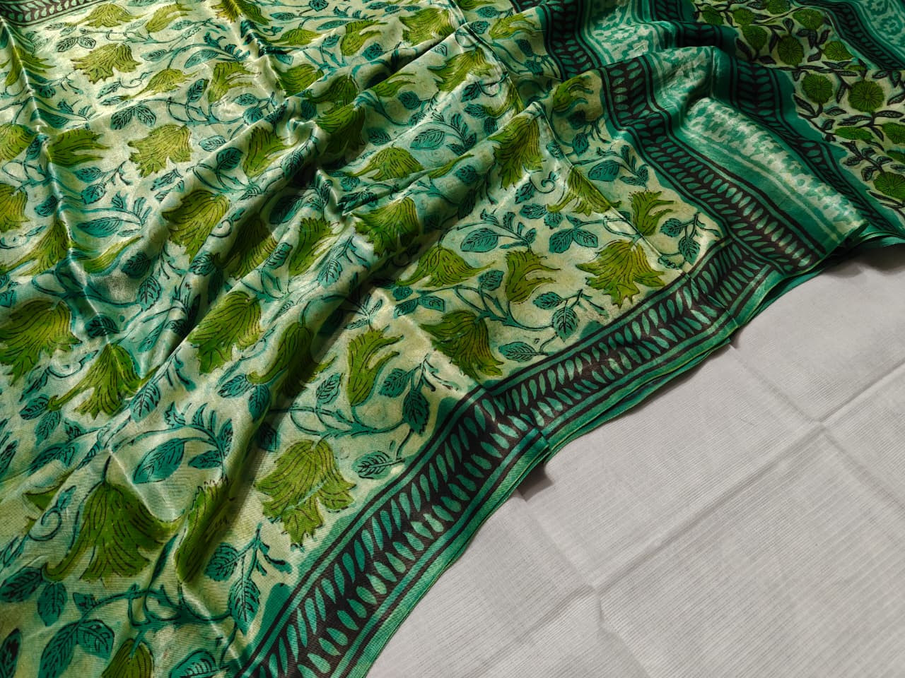 Green Vanaspati Ajrakh hand block printed modal silk saree. with printed blouse
