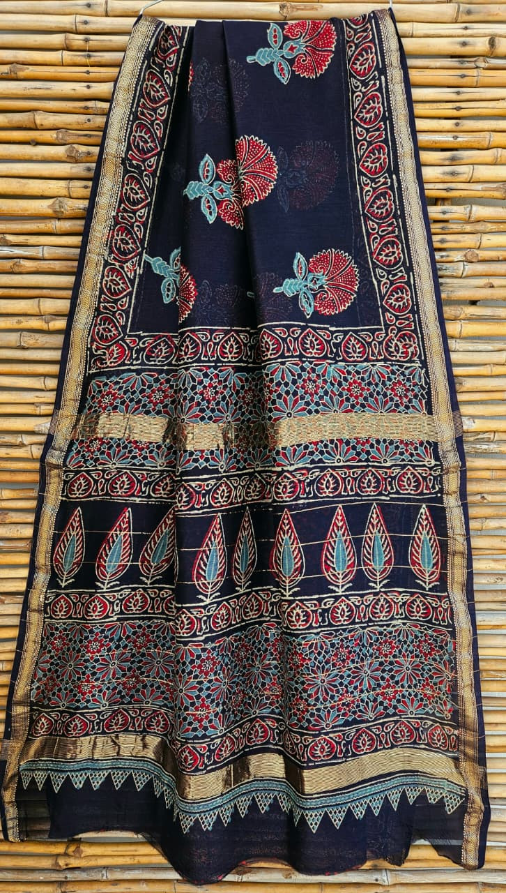 dark blue hand-block printed Maheshwari silk/cotton blend saree with traditional floral and leaf motifs and a golden zari border.