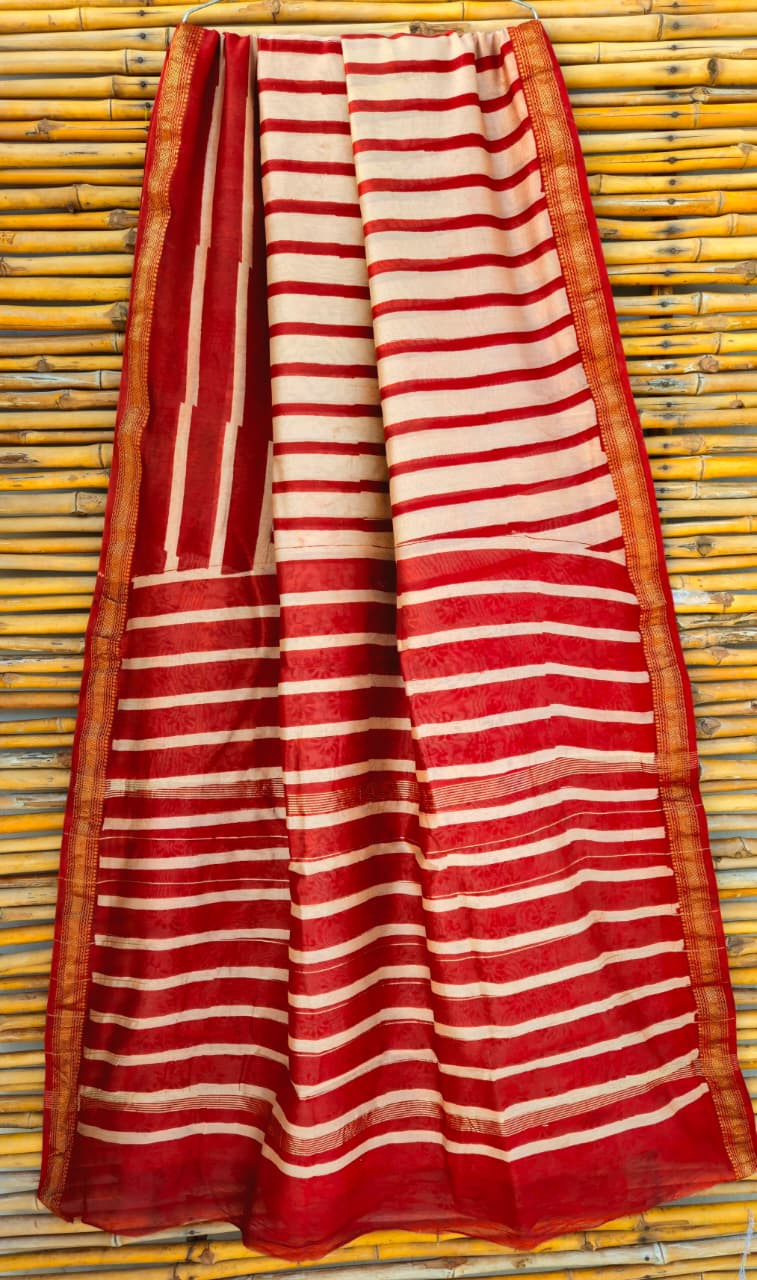 red and white striped hand-block printed Maheshwari or Chanderi silk/cotton blend saree with a golden zari border.
