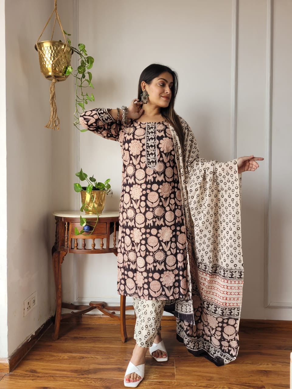 black and off-white floral block-printed cotton kurta set with matching pants and a dupatta.