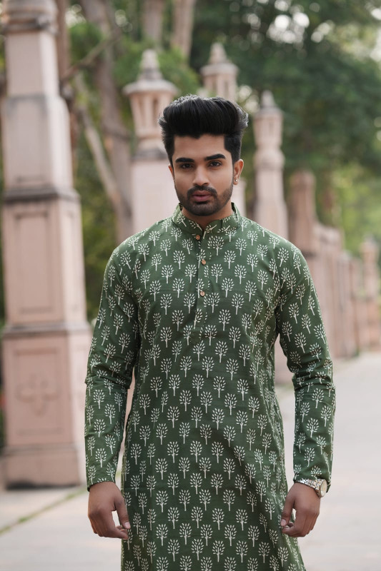 Olive green with a tree print or botanical print pattern.