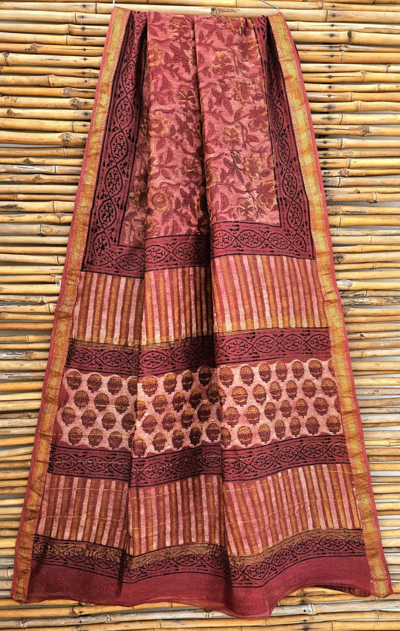 maroon and beige hand-block printed silk-cotton blend Maheshwari saree with a gold zari border