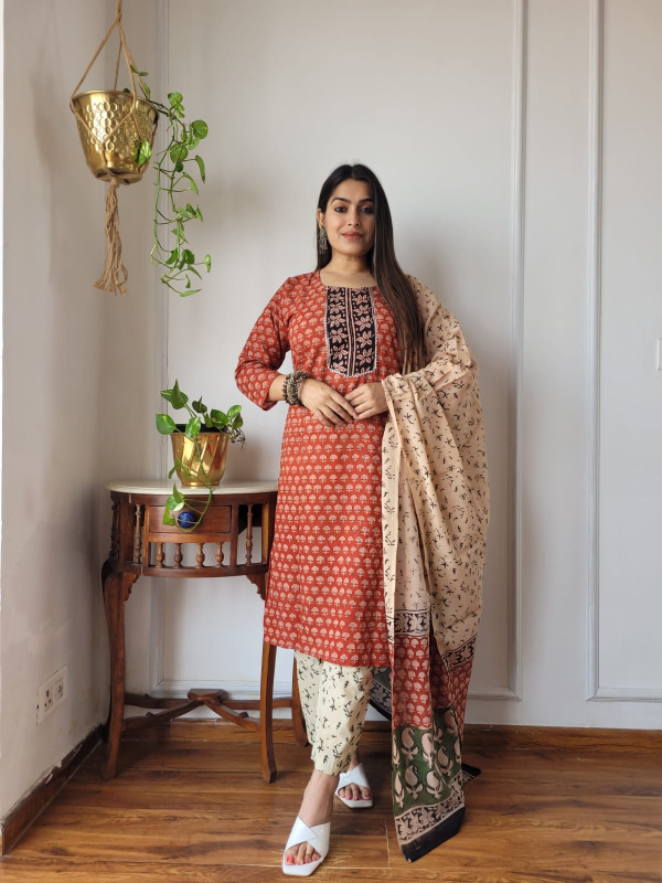 rust red and beige hand block printed cotton kurta, pants, and dupatta suit set