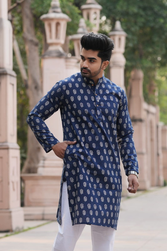 Navy blue or indigo blue with a hand block print, dabu print, or geometric/ethnic motif pattern.