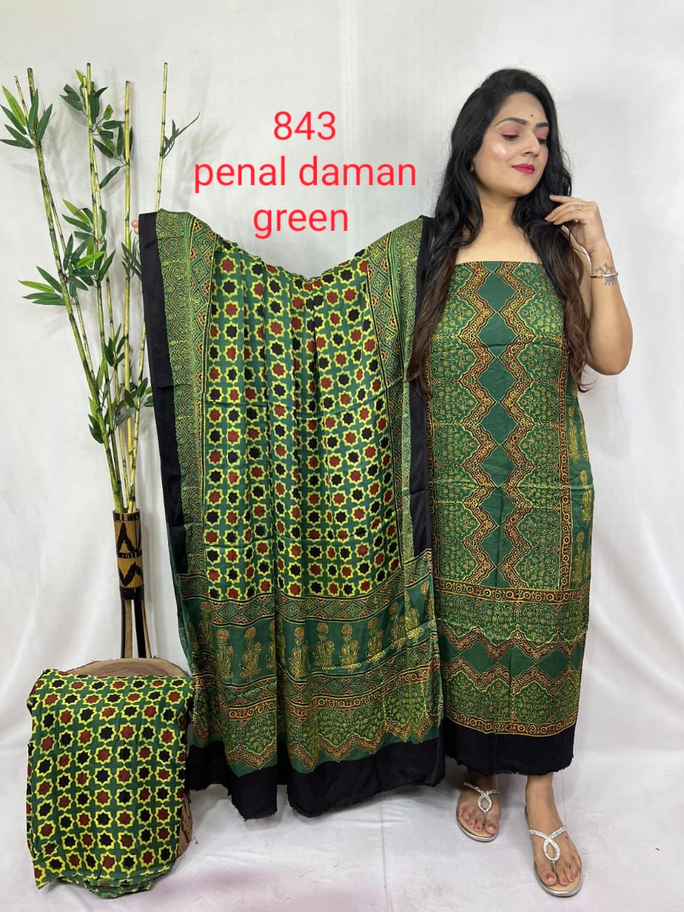 deep green muslin  hand block printing  geometric and floral patterns and contrasting black borders Bottom 2-5 miter ,Top 2-5 Miter ,Duppta 2-5 Miter.